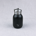 Compact insulated bottle in black, with stainless-steel lid and metal carrying loop.