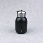 Compact insulated bottle in black, with stainless-steel lid and metal carrying loop.