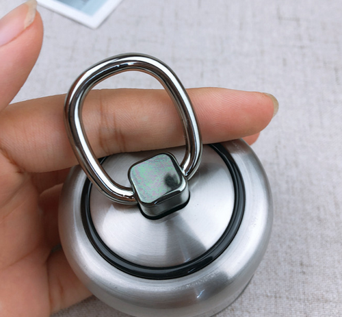 Close-up of the stainless-steel bottle lid with a metal carrying ring.