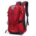 Red 40-litre hiking backpack with multiple zipped compartments, adjustable shoulder straps, side pockets, and reflective details.