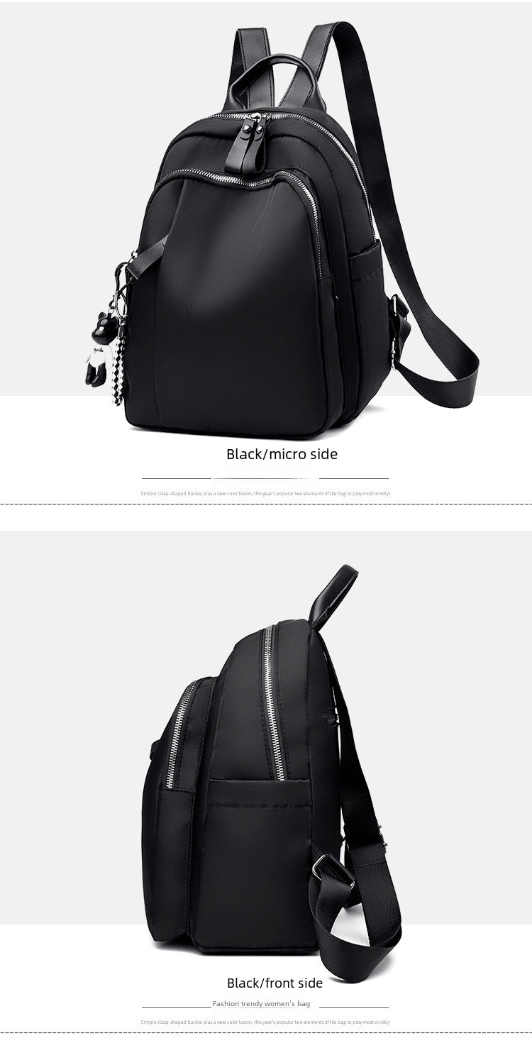 A black sling backpack shown from two angles on a light gray background, with text labels reading 'Black/micro side' and 'Black/front side'. The backpack has a smooth matte finish, multiple zippered compartments, and adjustable shoulder straps.